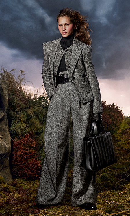 Max Mara Untamed Heroine campaign look with blazer, waistcoat, trousers, belt and black and white bag.